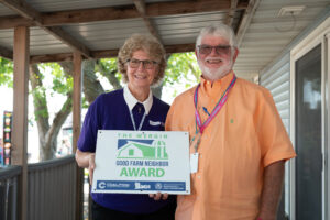 Ernie and Paula Barnes pictured with the Good Farm Neighbor award!