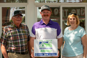 The Longinaker family, pictured with their Wergin Good Farm Neighbor Award.